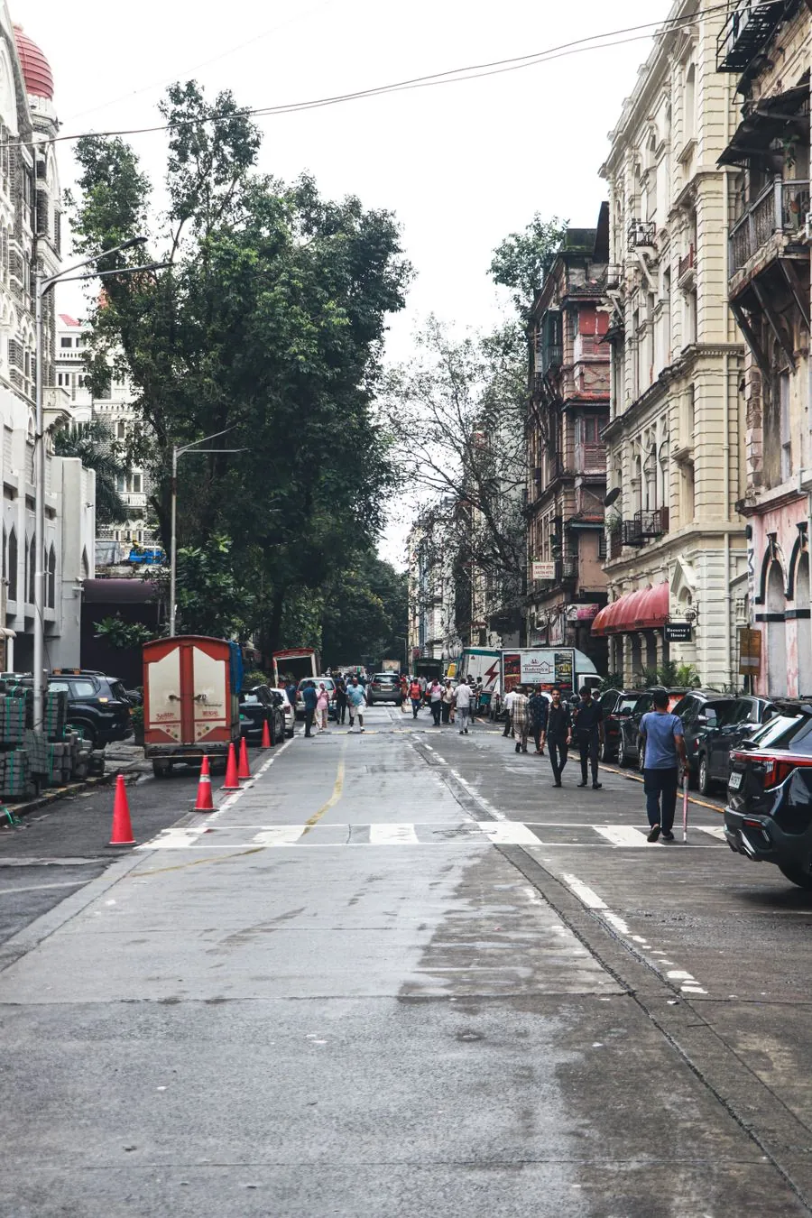 A city street lined with historic buildings in Mumbai.